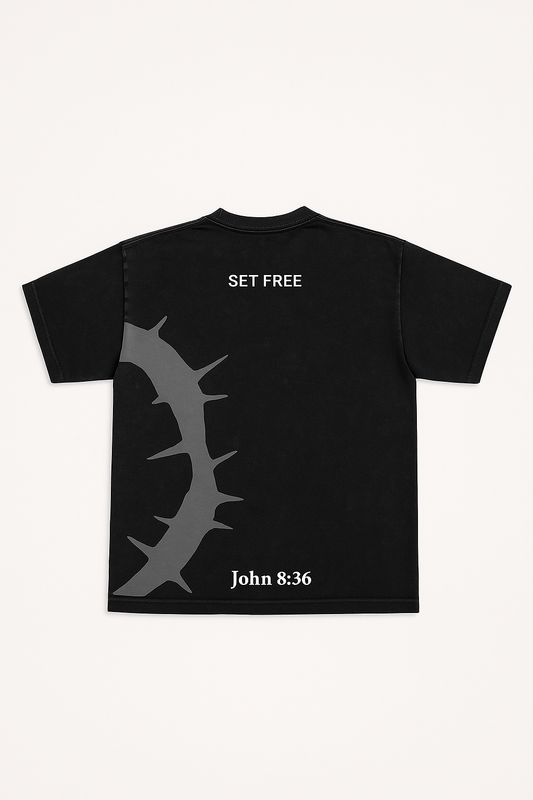 Black Christian t-shirt with “Set Free” text and John 8:36 Bible verse featuring thorn cross design